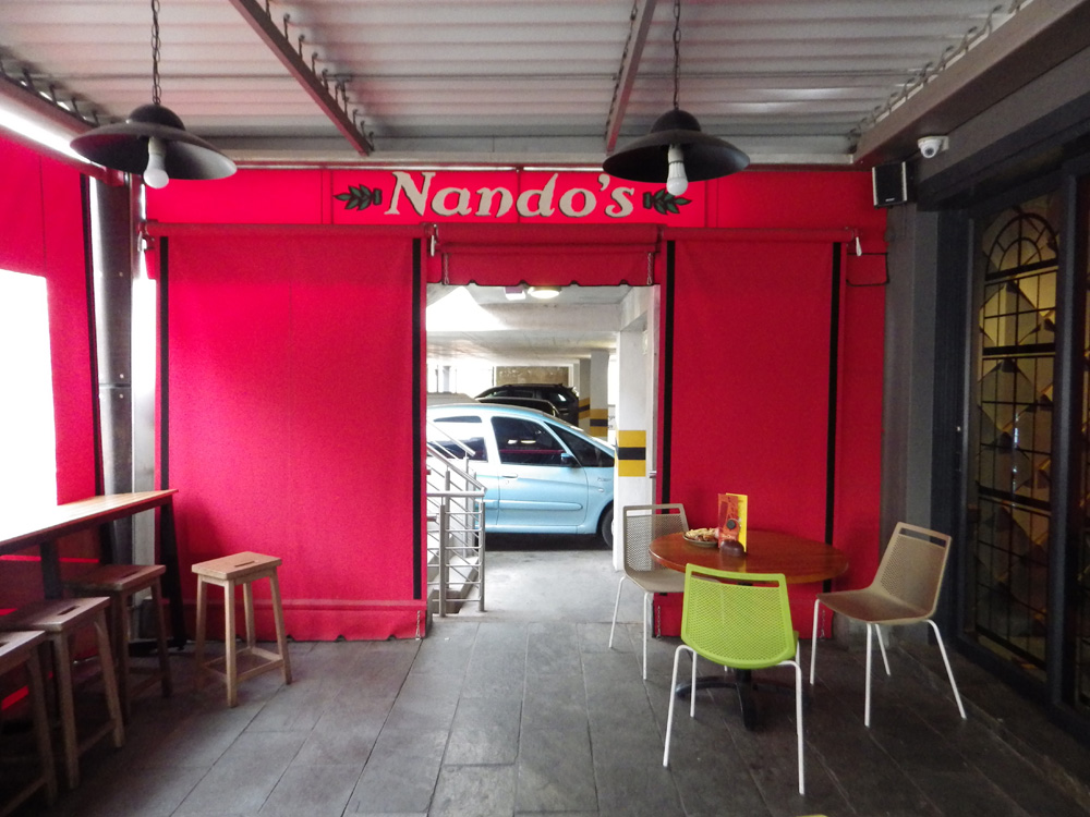 nandos-patio-blind-with-windows-and-zip-door Nandos patio canvas blinds with windows and zip door